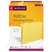 A yellow box of Smead letter size hanging file folders with yellow repositionable poly tabs.
