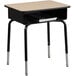 A Flash Furniture natural laminate student desk with a black book box on the front.