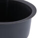 A Matfer Bourgeat black steel round ramekin mold.