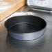 A Matfer Bourgeat non-stick round cake pan on a counter.