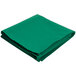 A folded green cloth on a white background.