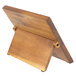 A Mercer Culinary Z&#252;M&#174; Acacia magnetic board and knife set on a wooden stand.
