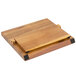 A Mercer Culinary Z&#252;M&#174; acacia wooden cutting board with metal handles.
