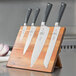 A set of Mercer Culinary Z&#252;M knives on a wooden board