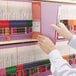 A person holding a lavender Smead Shelf-Master file folder.