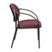 A Eurotech Dakota burgundy curved arm chair with a black frame and armrests.