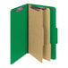 A green Smead SafeSHIELD legal size file folder with brown paper inside.