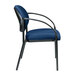 A Eurotech Dakota navy curved arm chair with black metal legs.