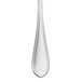 A close-up of a Libbey stainless steel dinner fork with a black handle.