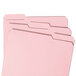 A group of Smead pink letter size file folders with reinforced 1/3 cut tabs.