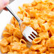 A Libbey stainless steel dessert fork in a bowl of pasta.