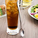 A glass of iced tea with a Libbey stainless steel iced tea spoon.