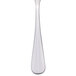 A Libbey stainless steel demitasse spoon with a white handle.