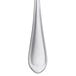 A close-up of a Libbey stainless steel bouillon spoon with a silver border.