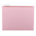 A pink Smead hanging file folder with a white repositionable poly tab.