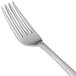 A Libbey stainless steel dessert fork with a silver handle.