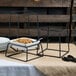 A table with bowls of cereal on black Libbey Versa risers.