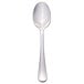 A Libbey stainless steel serving spoon with a silver handle.
