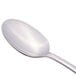 A Libbey stainless steel serving spoon with a silver handle.