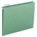 A bright green Smead file folder with white repositionable poly tabs.