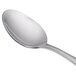 A Libbey stainless steel dessert spoon with a silver handle.