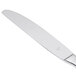 A Libbey stainless steel dinner knife with a serrated solid handle.