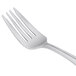 A close-up of a Libbey antique stainless steel salad fork.