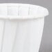 A Solo white paper portion cup.