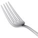 A close-up of a Libbey stainless steel salad fork with a silver handle.