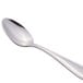 A Libbey stainless steel demitasse spoon with a silver handle.