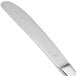 A Libbey stainless steel dinner knife with a serrated solid handle.