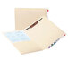 A Smead Manila file folder with paper inside.