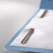 A blue Smead file folder with metal fasteners.