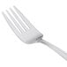 A close-up of a Libbey Cortland stainless steel salad fork with a silver handle.