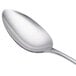 A Libbey stainless steel serving spoon with a silver handle.