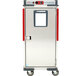 A silver stainless steel Metro holding cabinet with a red and silver metal container inside.