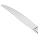 A Libbey stainless steel steak knife with a fluted silver handle.