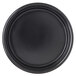 A black ramekin with a white background.