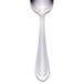 A silver spoon with a white handle.