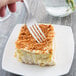 A Libbey stainless steel dessert fork in a piece of cake.