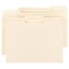 Three Smead file folders with 1/3 cut tabs on a white surface.