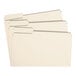 A group of Smead file folders with white tabs.