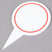 a white and red marker with a red circle