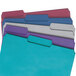 A stack of Smead file folders with assorted colors on tabs.