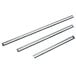 A group of metal rods with black handles.