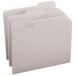 A group of gray Smead letter size file folders with 1/3 cut tabs.