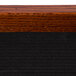 A close up of a wood frame with a wood grain.
