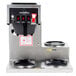 A Bloomfield Koffee King automatic coffee brewer with three burners on a counter.