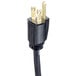 A black electrical plug with gold tips on a Bloomfield coffee brewer.