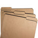 A stack of Smead kraft letter size file folders with reinforced assorted tabs.